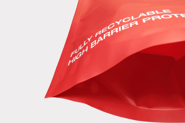 Heavy-duty BOPE recyclable pet food bag with a reinforced base and PE zipper filled with kibble