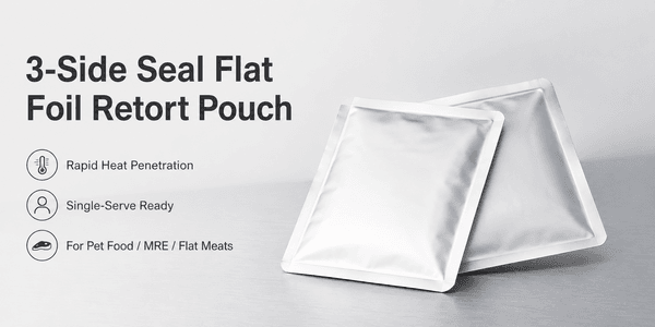 Flat single-serve foil retort pouches stacked showing tear notch and rounded corners