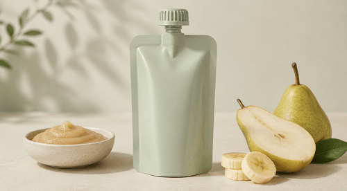 Recyclable spouted baby food puree pouch with tamper-evident cap on a clean nursery surface