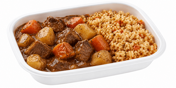 Outdoor retort meal pouch beside a camping stove