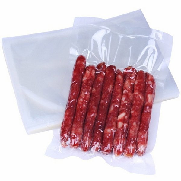 Transparent retort pouch with curry sauce visible inside, stand-up format, professional product photography