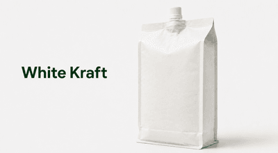 White kraft flat bottom spout pouch with a clean minimal label on a bright shelf